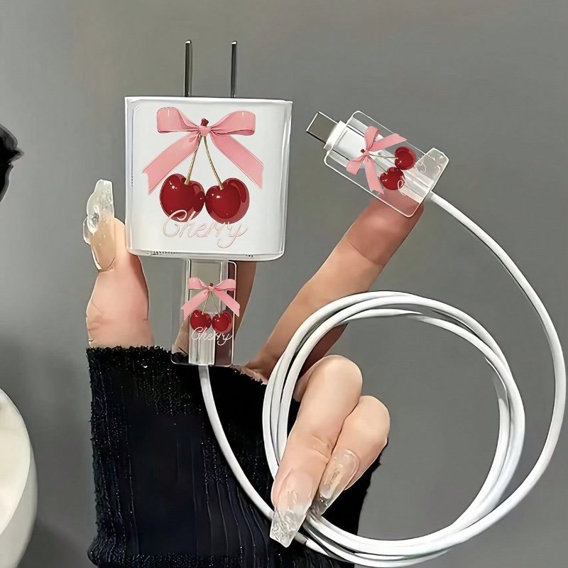 Kit de 3 accessoires pour chargeur iPhone : coque de protection transparente et mignonne (motif cerise et nœud) + décoration pour câble de données.